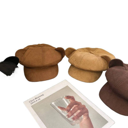 Three brown hats displayed with a card featuring a hand holding a phone on a white background.