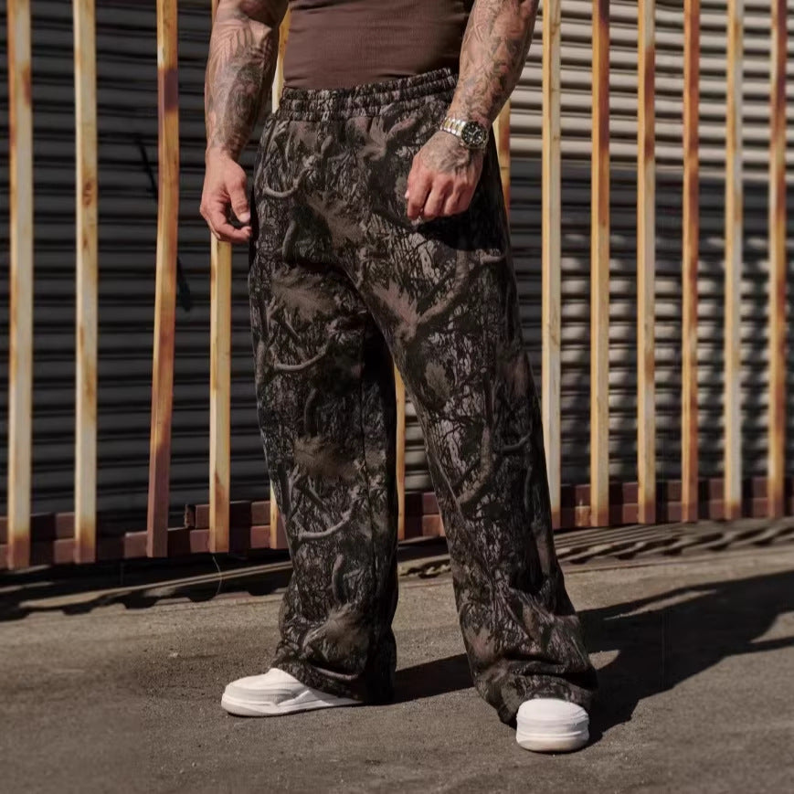 Person wearing camouflage pants with a rustic metal wall background