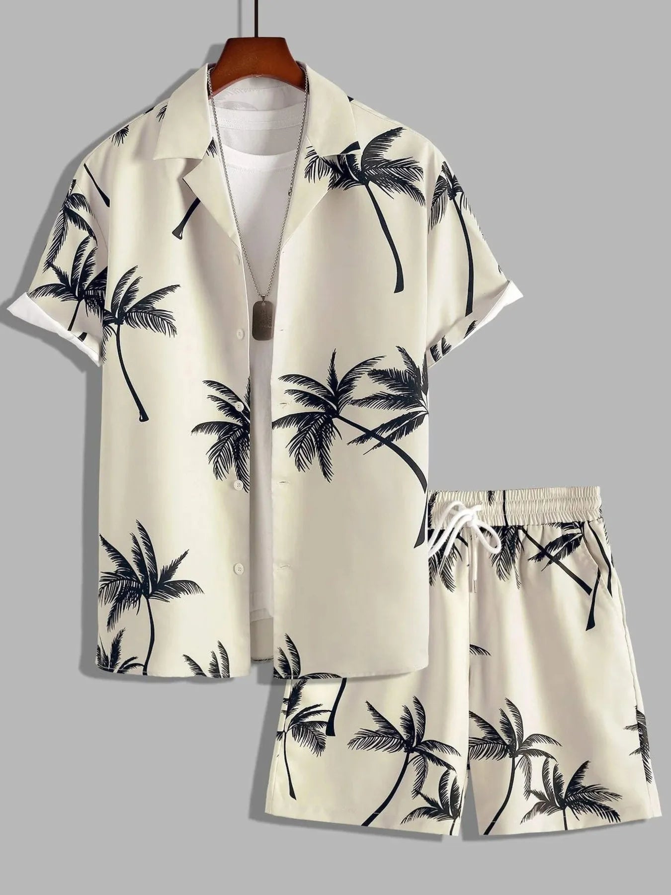 Hawaiian shirt and shorts set with palm tree pattern on a gray background