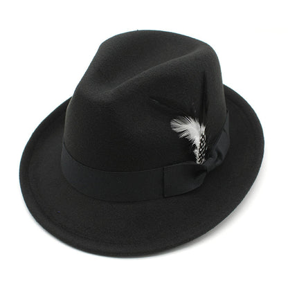 Black fedora hat with a feather detail on a white background