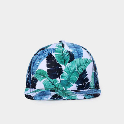 Cap with tropical leaf pattern on a light gray background