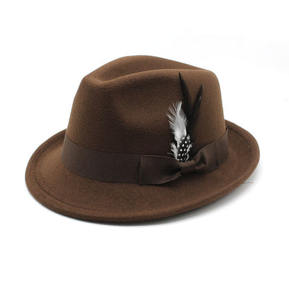 Brown fedora hat with a feather on a white background