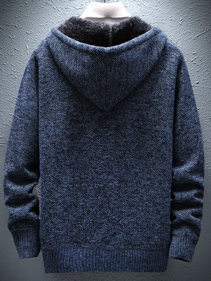 Blue hooded sweater on a gray background