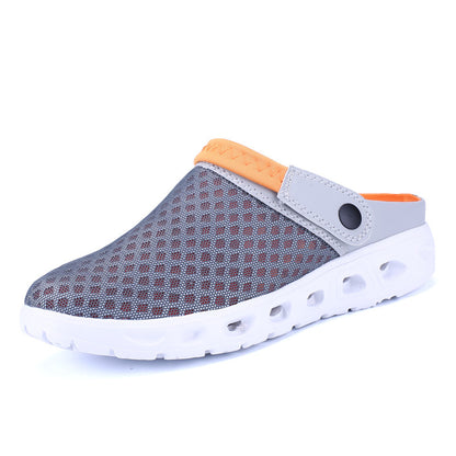 Gray slip-on shoe with orange accents on a white background