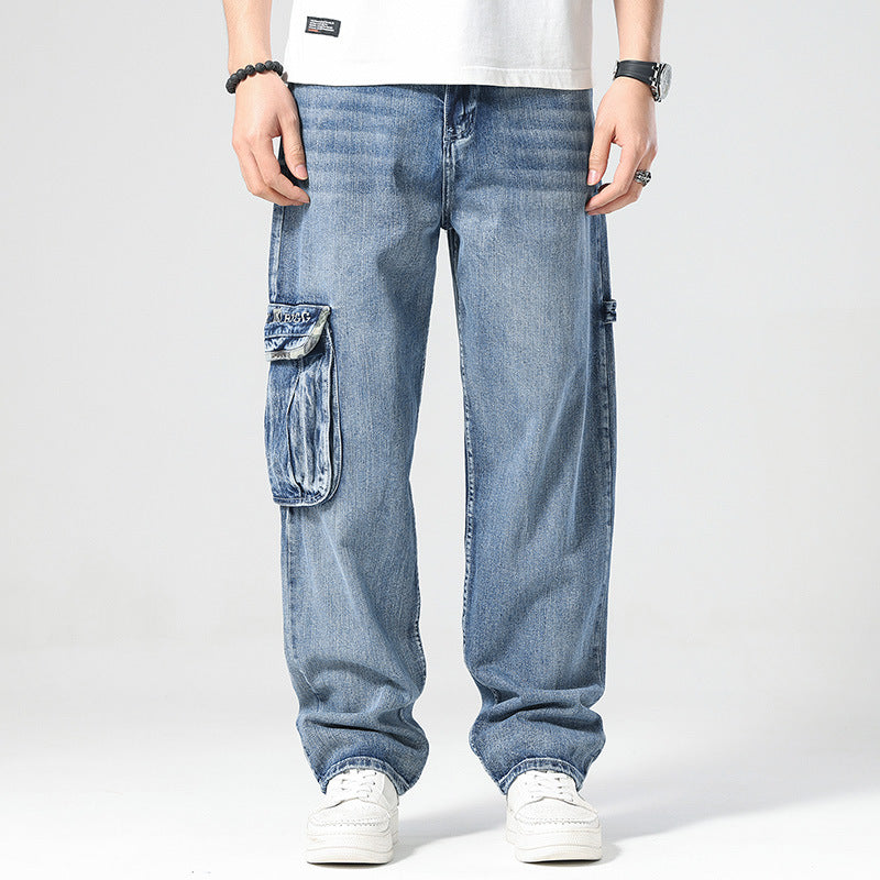 Person wearing blue cargo jeans on a white background