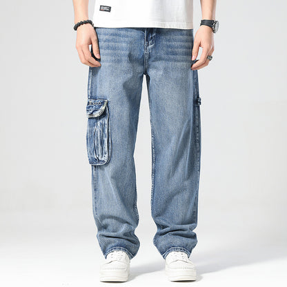 Person wearing blue cargo jeans on a white background