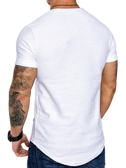 Man wearing a plain white t-shirt on a white background