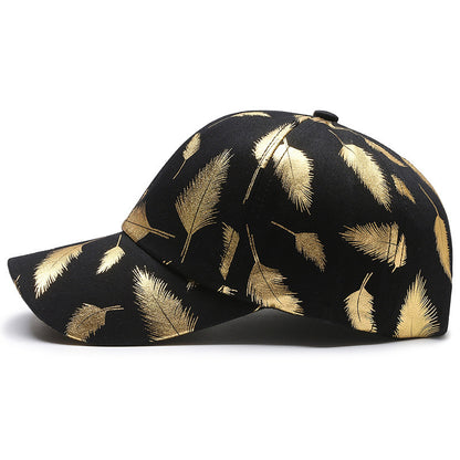 Black cap with gold leaf pattern on a white background