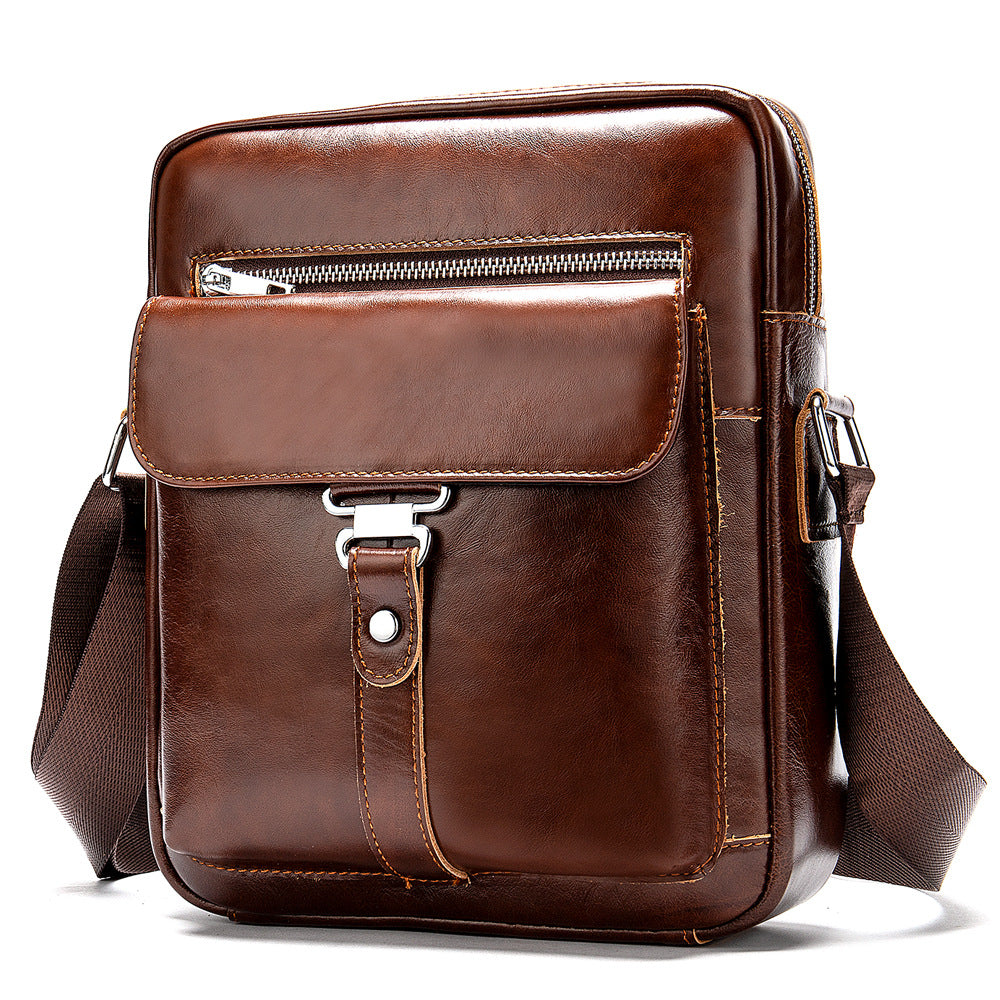 Brown leather crossbody bag on a white background