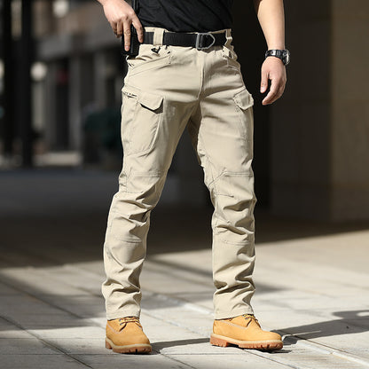 Person wearing beige tactical pants with a blurred background