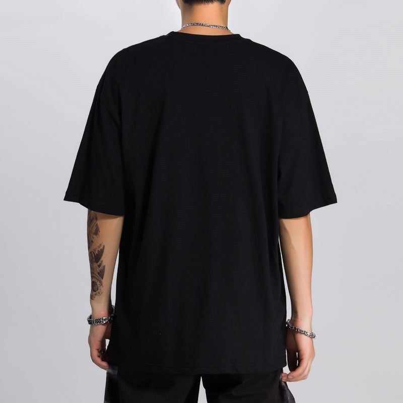 person wearing a black tshirt on a white background.