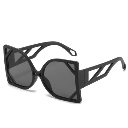 Black geometric sunglasses with dark lenses on a white background