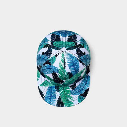 Cap with tropical leaf pattern on a light gray background