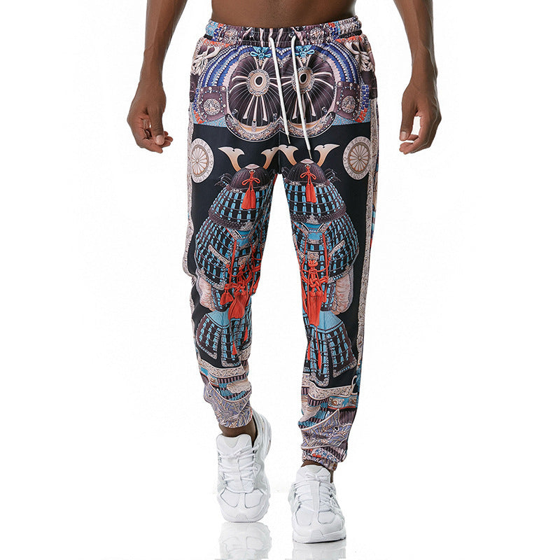 Colorful patterned jogger pants worn by a person on a white background