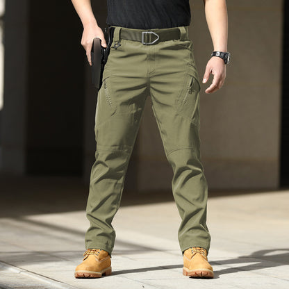 Person wearing green tactical pants with a blurred background