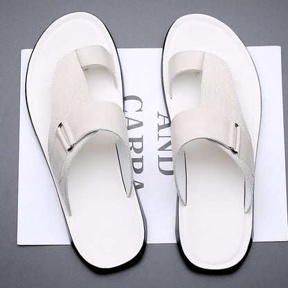 White sandals on a magazine with visible text