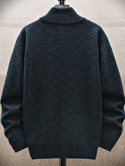 Dark green textured sweater on a mannequin against a beige background