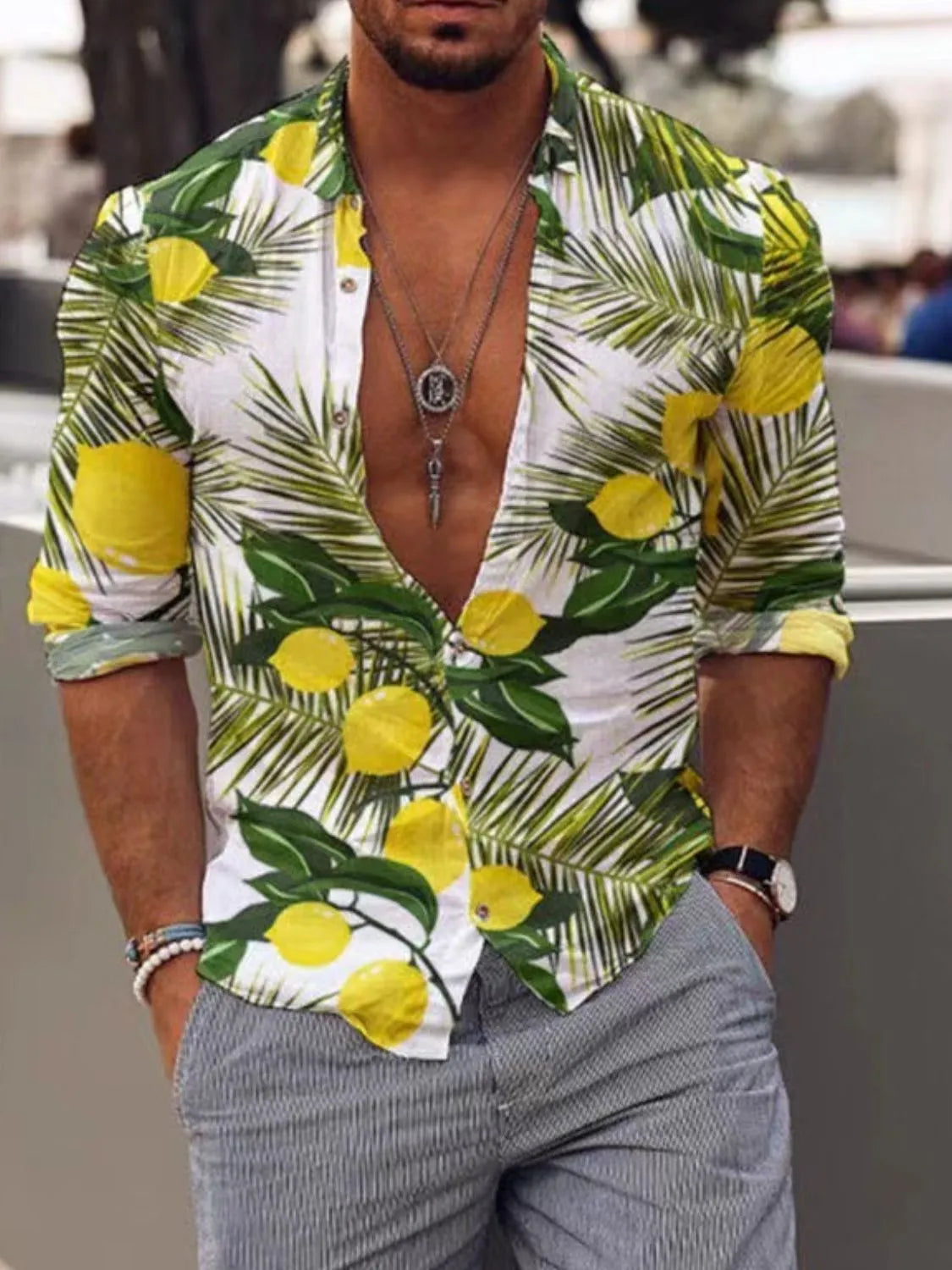 Man wearing a tropical shirt with lemon and leaf pattern