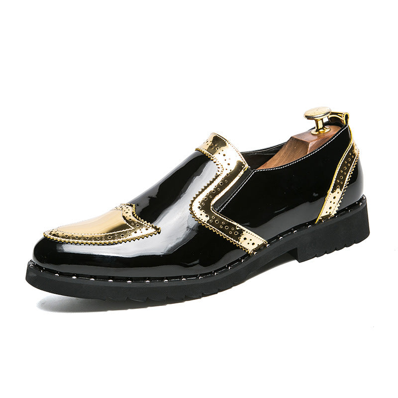 Black shoes with gold accents on a white background