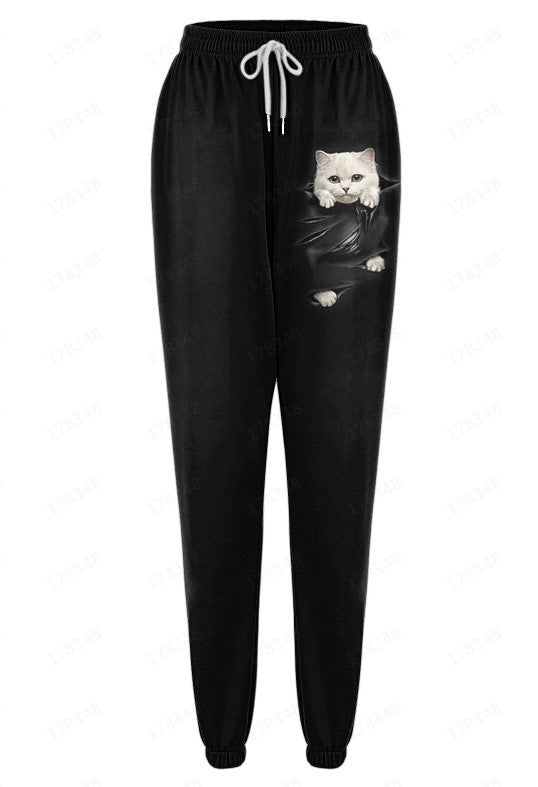 Black jogger pants with a cat graphic on a white background