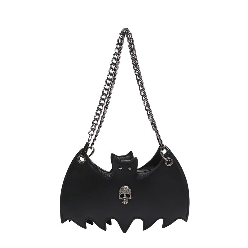 Handbag shaped as a bat on a white background.
