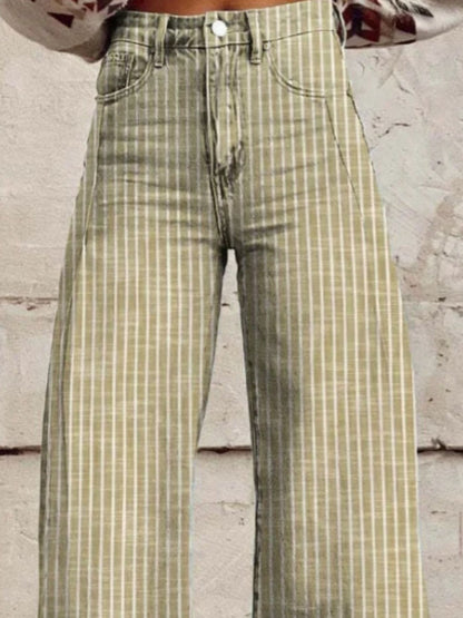 Green and beige checkered pants worn by a person against a light-colored wall.