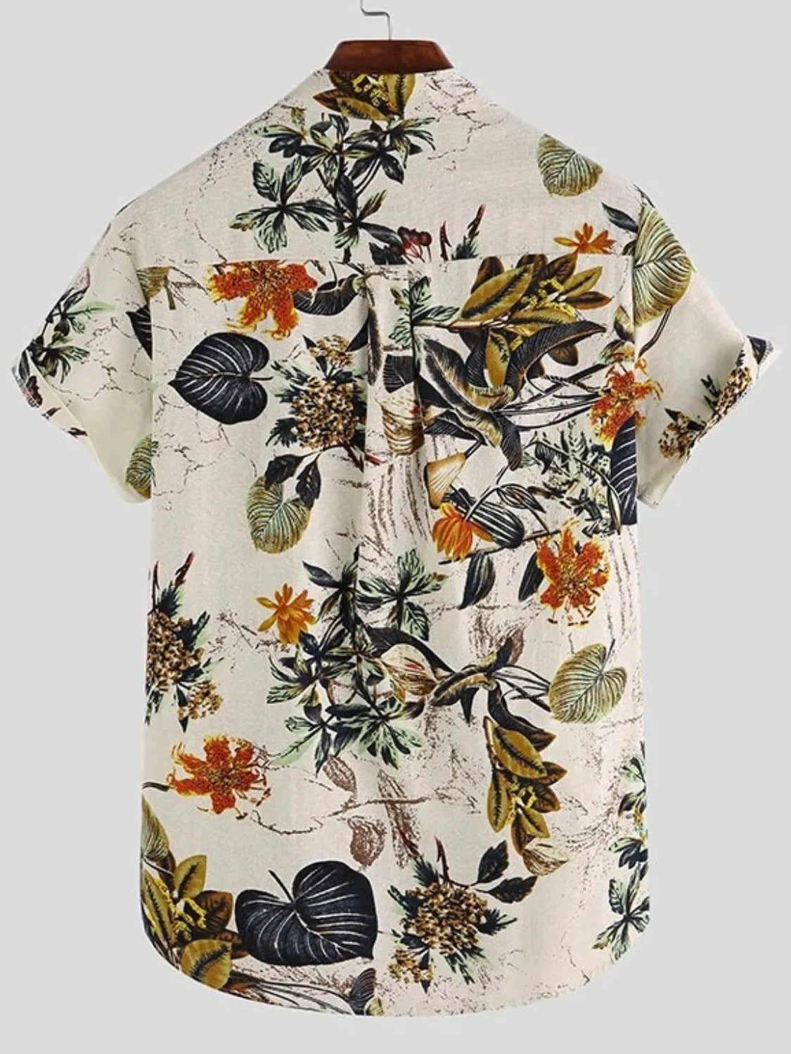 Floral patterned shirt on a hanger against a white background