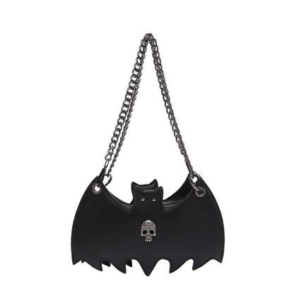 Handbag shaped as a bat on a white background.