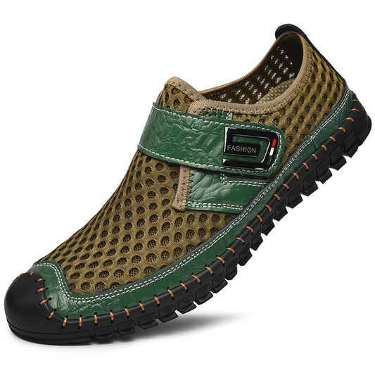 Green shoe with black sole on a white background