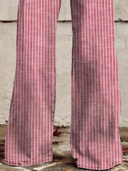 Red and white checkered pants against a gray concrete wall.