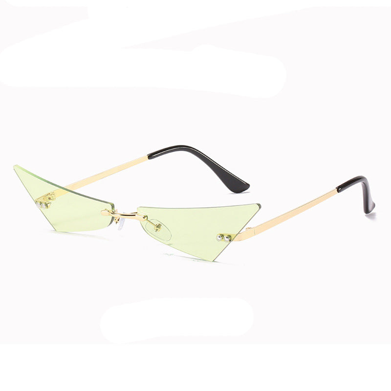 Sunglasses with green lenses and gold frames on a white background