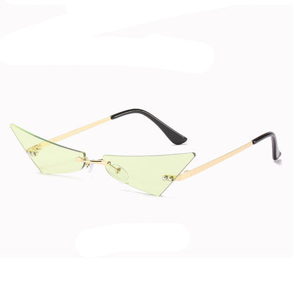 Sunglasses with green lenses and gold frames on a white background