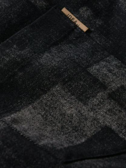 Close-up of a black and gray checkered fabric with a brand label.
