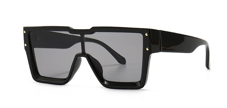 Black sunglasses with a large frame on a white background