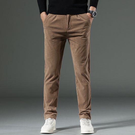 Person wearing brown corduroy pants with a plain background