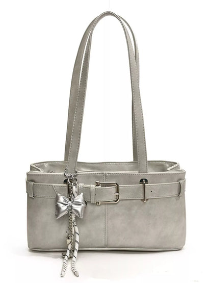 Gray handbag with a bow charm on a white background