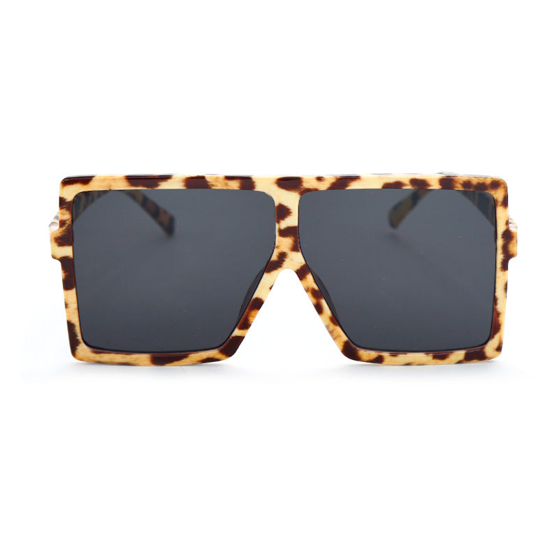 Sunglasses with tortoiseshell frame and dark lenses on a white background
