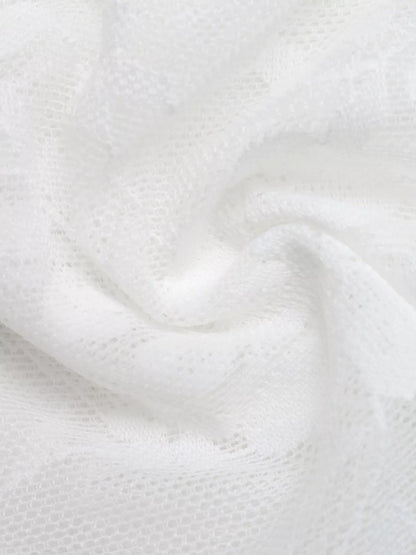 Close-up of white fabric with a textured pattern