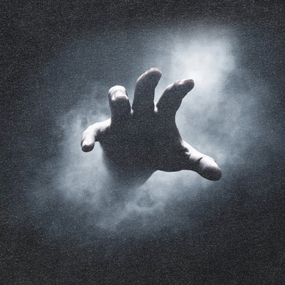 Silhouette of a hand reaching out from a dark background with a light source above.
