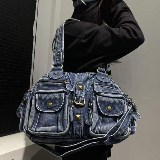 Demim pocketed shoulder bag on a white background