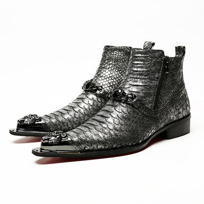 Pair of silver metallic boots with decorative elements on a white background