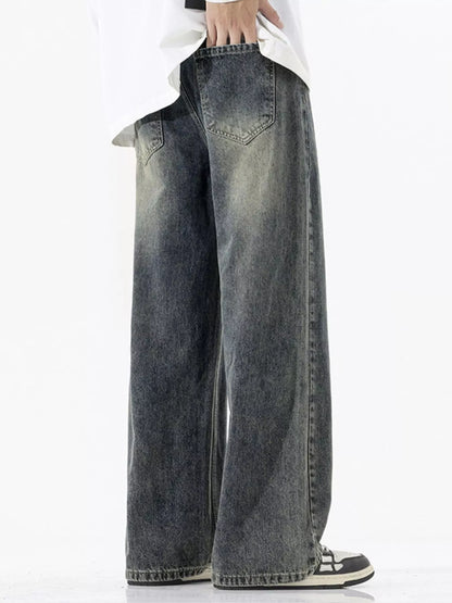 Person wearing wide-leg jeans on a white background