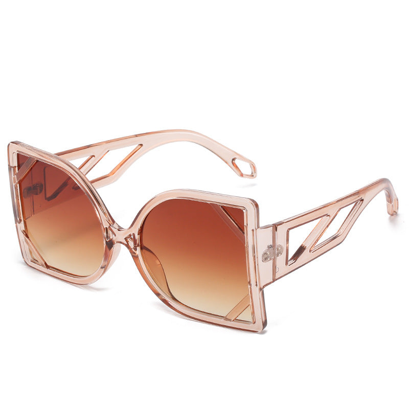 Rose gold sunglasses with brown gradient lenses on a white background