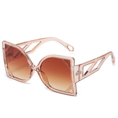 Rose gold sunglasses with brown gradient lenses on a white background
