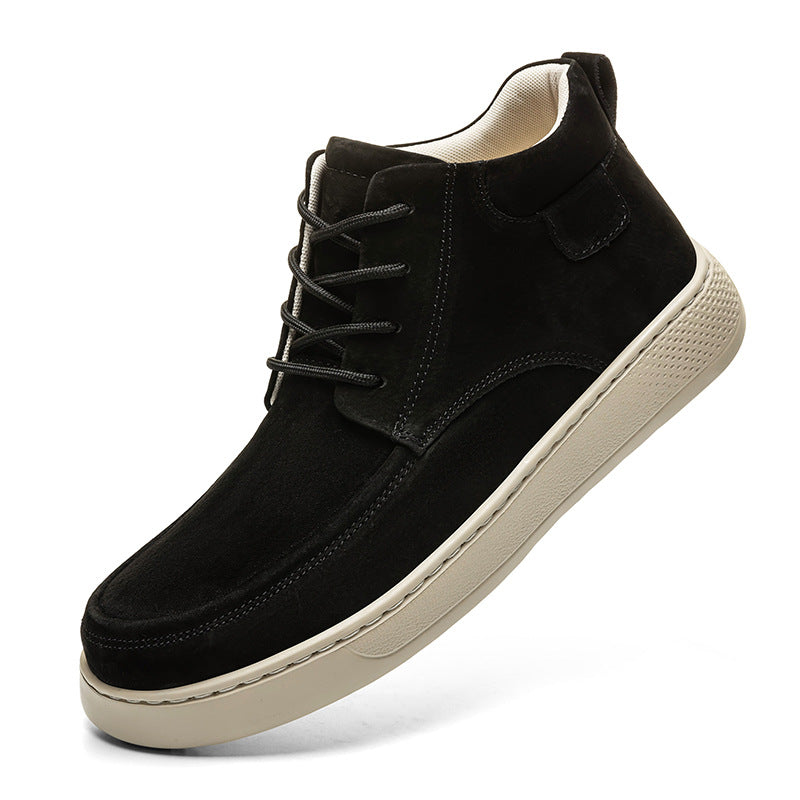Black suede shoe with beige sole on a white background