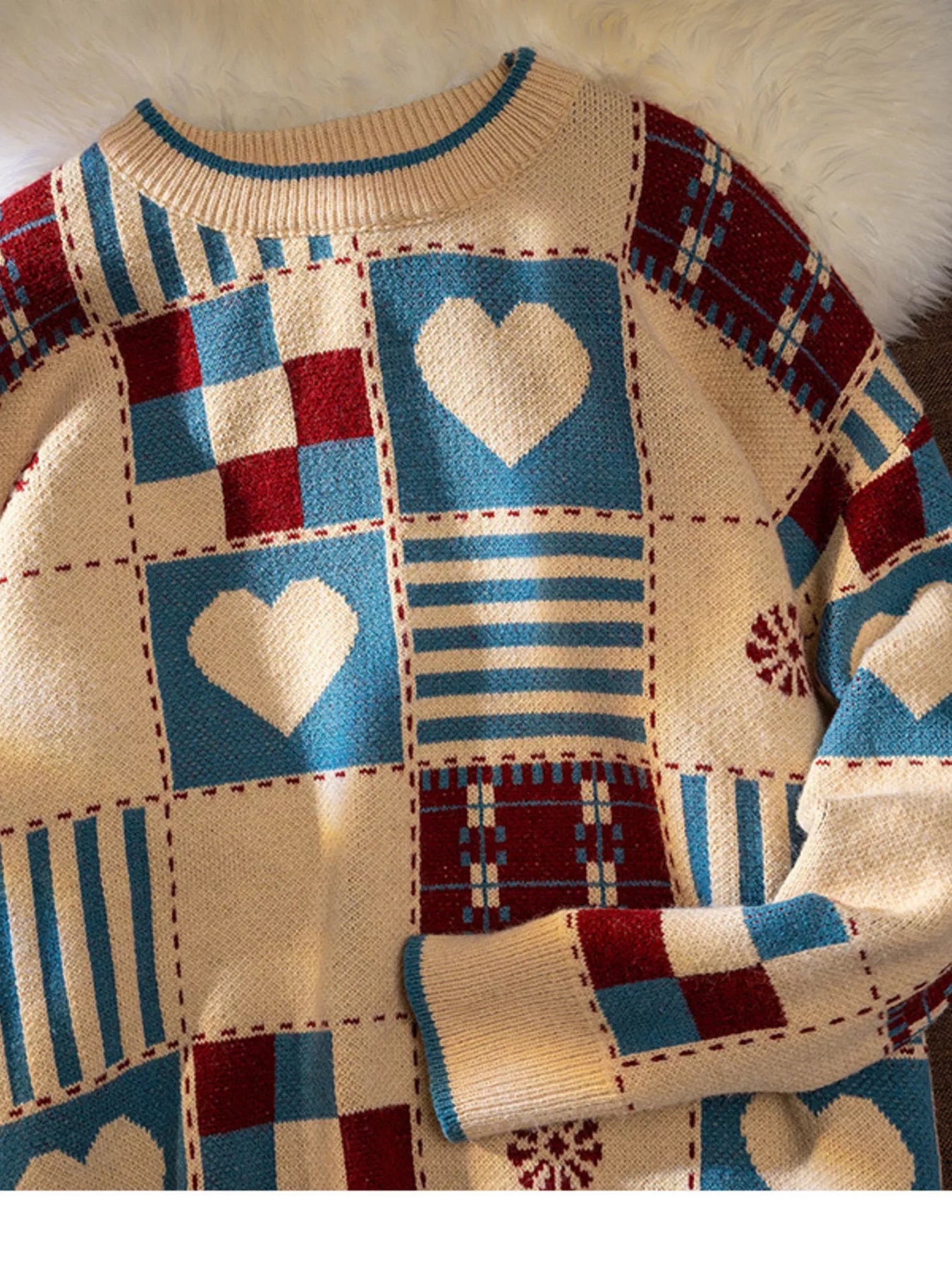 Patchwork sweater with heart patterns on a textured background