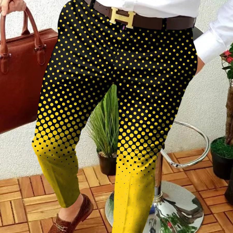 Person wearing black pants with yellow polka dots, holding a red handbag indoors.