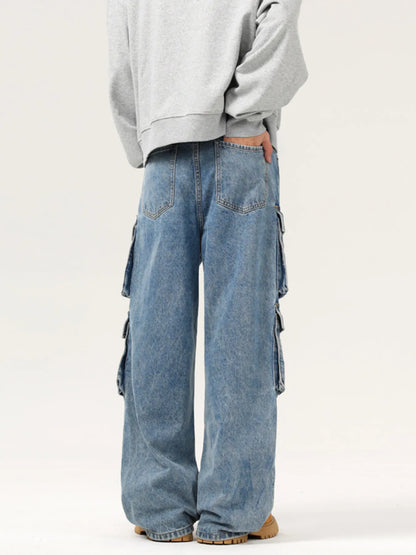 Person wearing light blue cargo jeans and a gray sweatshirt on a white background