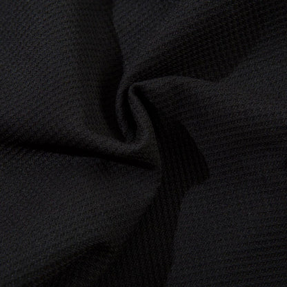 Close-up of dark textured fabric