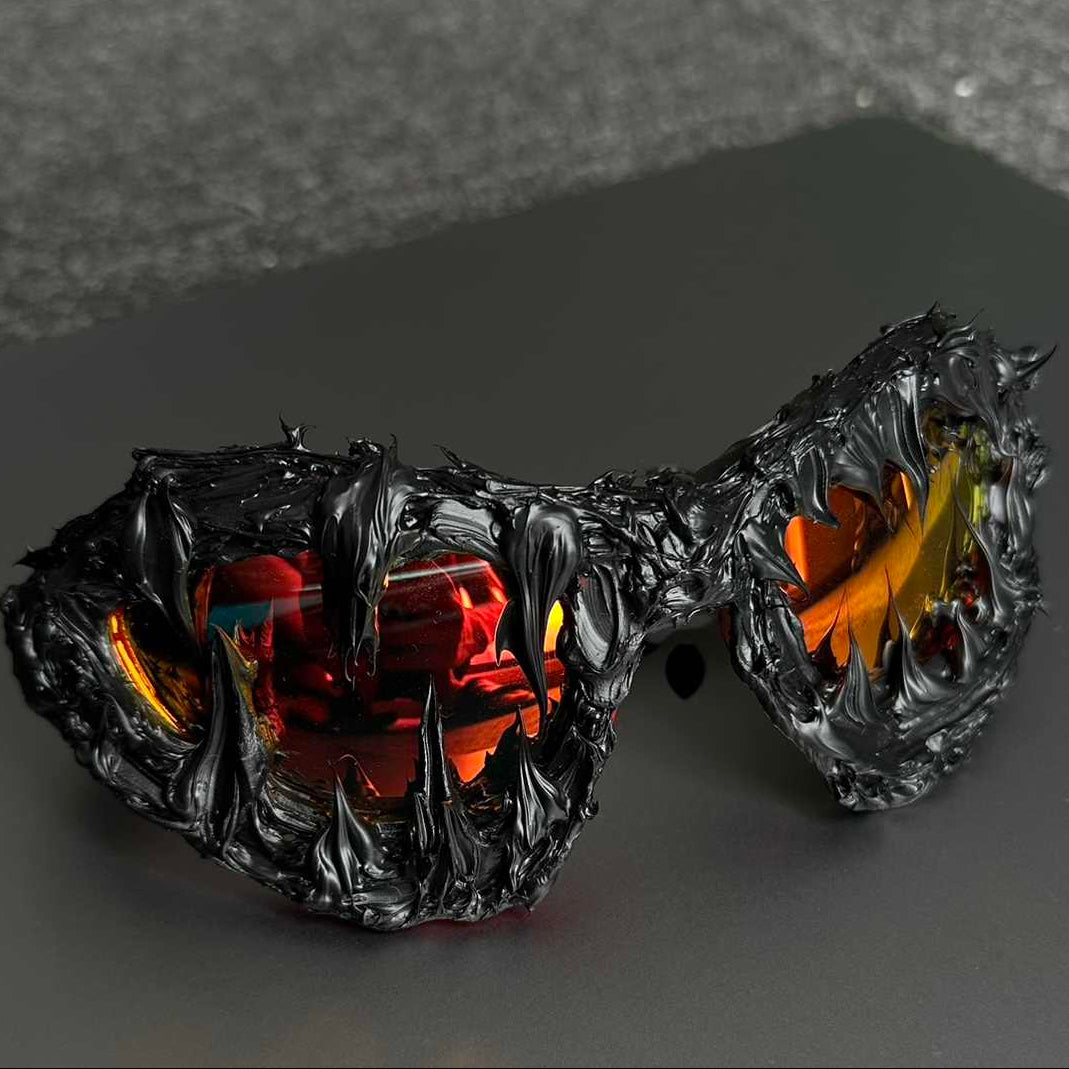 Glowing black and orange sunglasses with a dark background
